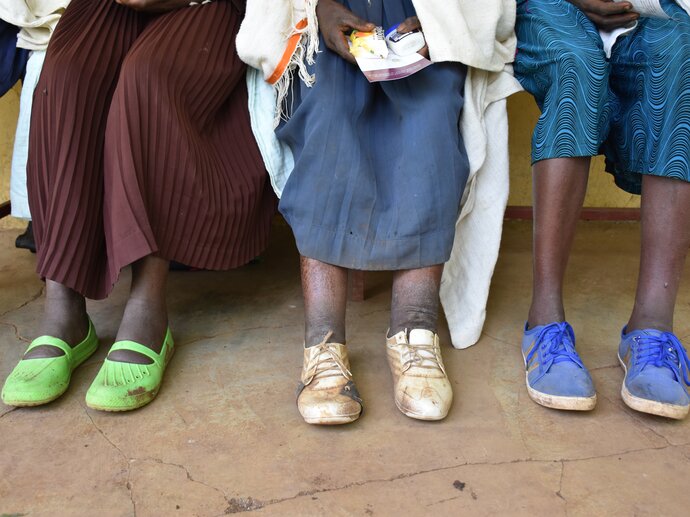 Women with podoconiosis wait outside a clinic in Ethiopia