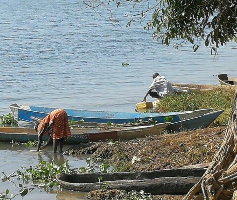 Water collection along the Nile River, Kamuli District, Uganda