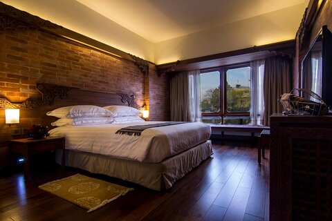 Heritage Delux Room | with restored rich and Exquisite Nepali traditional architecture, these rooms are individually created with soft intimate illumination